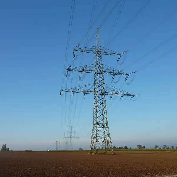 Overhead power transmission line crossing open farmland