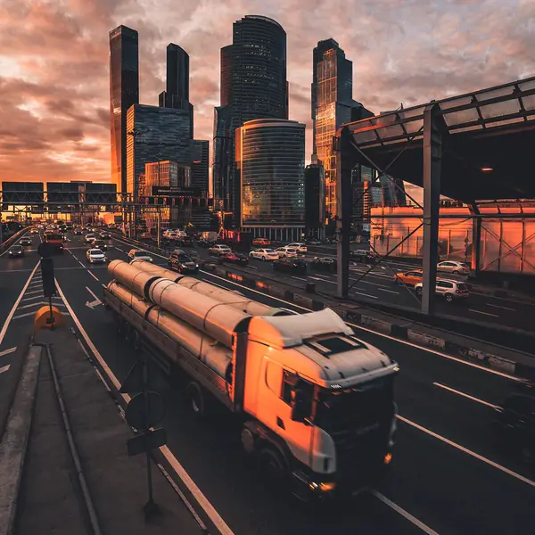 Freight vehicle on a city expressway at dusk